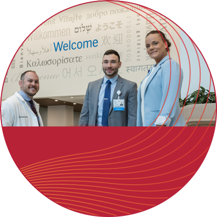 Why attend - three pharmacists standing and smiling